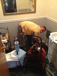 Mckinney plumbing contractor cleans toilet drain